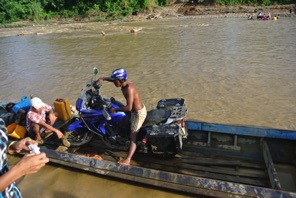 Local people helped us to cross the rivers on boats